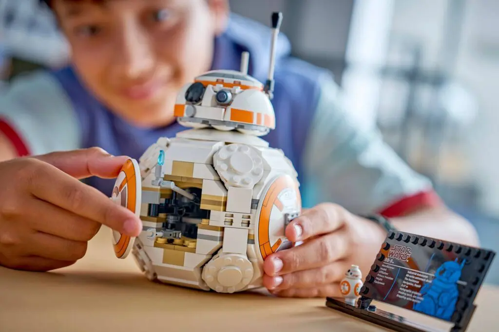 Kid assembling Star Wars LEGO set