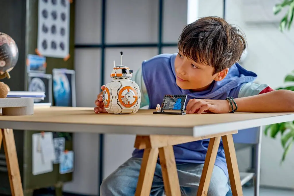 Youngster enjoying building set at table