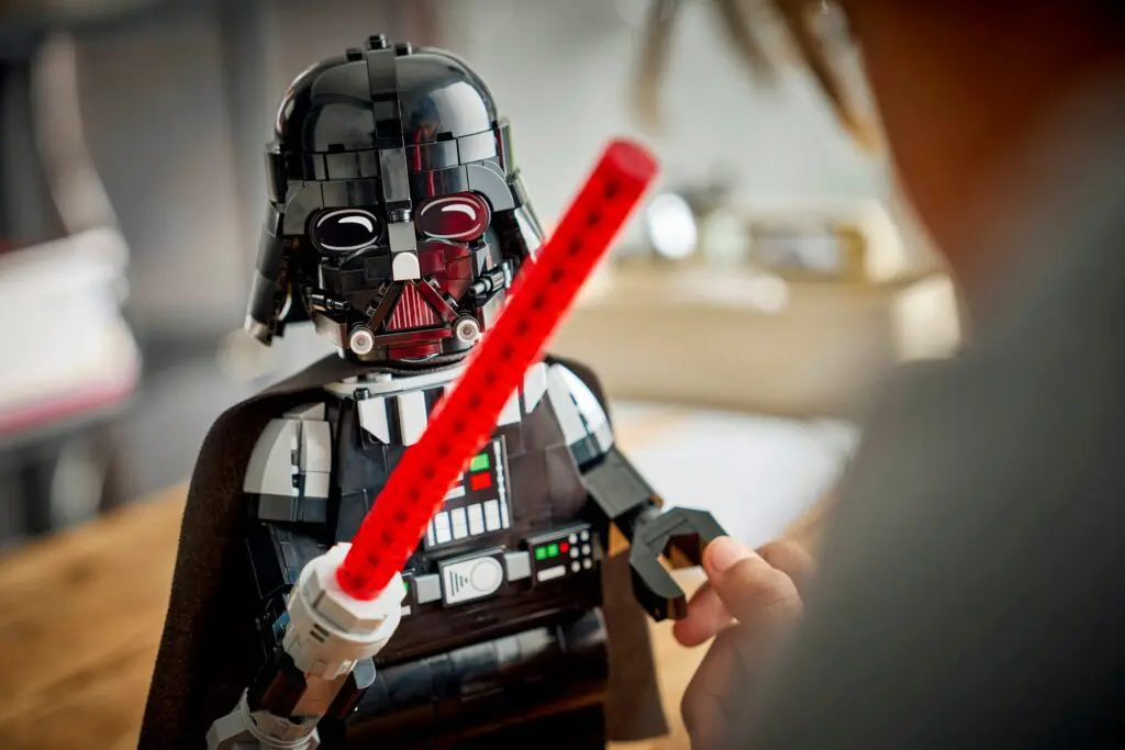 LEGO character with red lightsaber