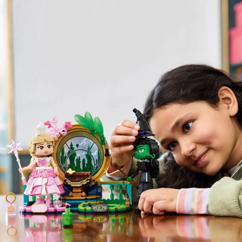 Young girl interacting with doll set