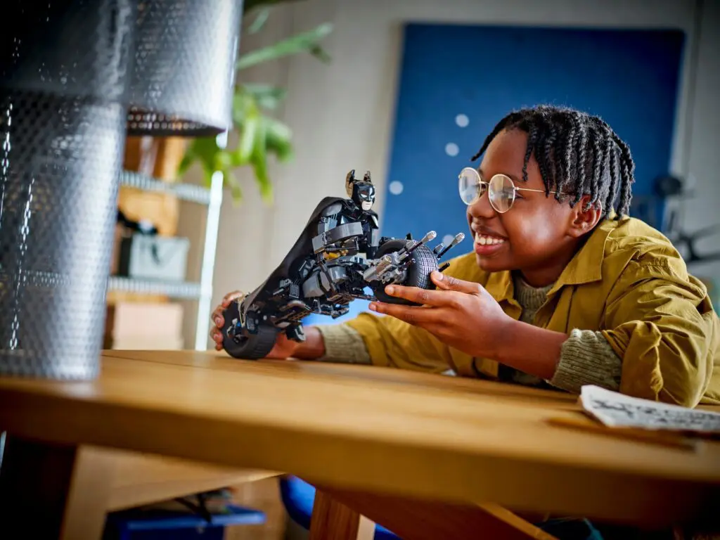 Boy enjoying building a motorcycle model