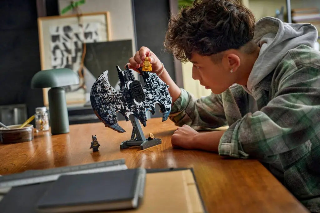 Enthusiast constructing LEGO collectible figure
