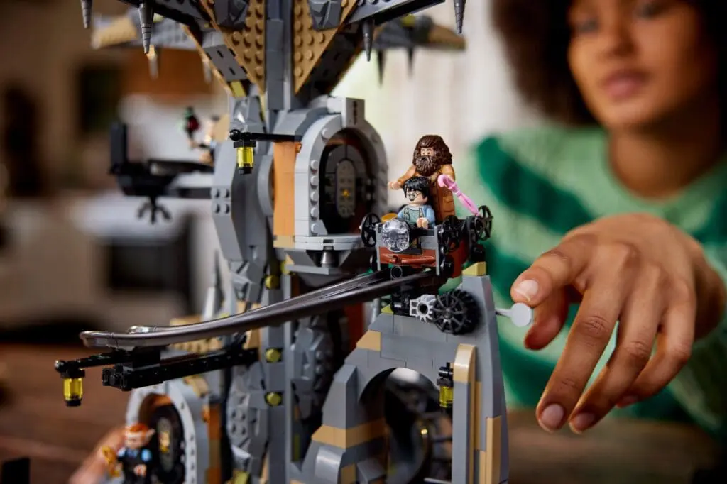 Person playing with detailed LEGO structure