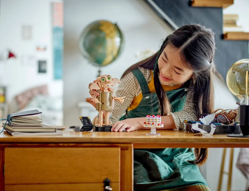 Girl building a robot at desk