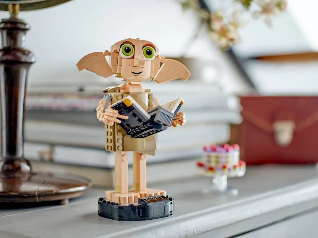 LEGO figure holding a book
