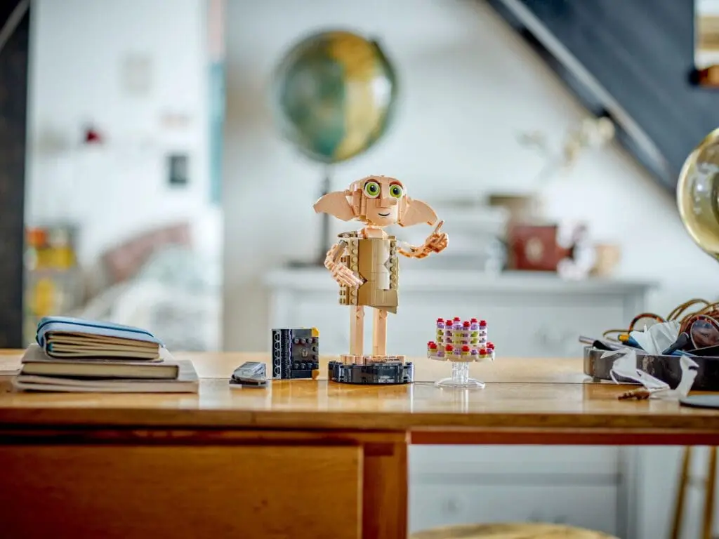 Cute character surrounded by colorful objects