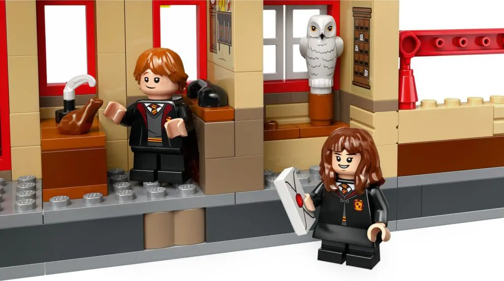LEGO figures with owl and letters