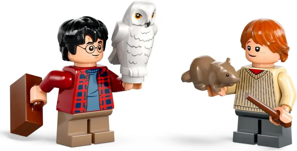 Toy characters holding animals and suitcase