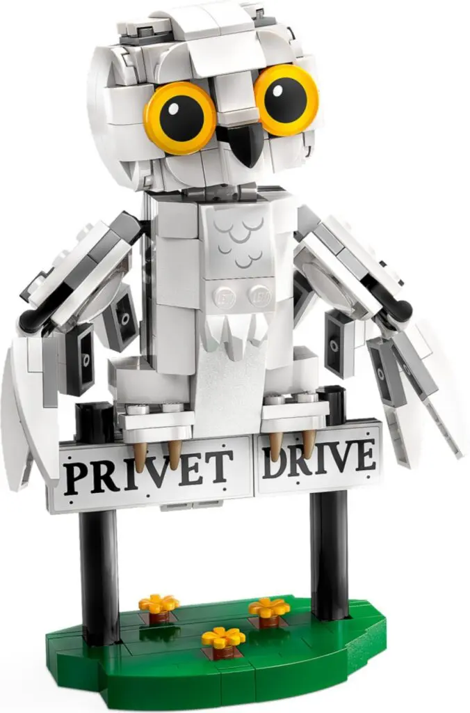 Toy owl with yellow eyes on sign
