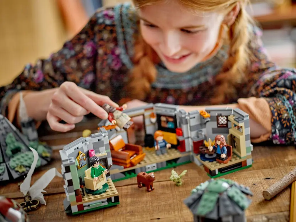 Girl enjoying intricate toy figurine setup