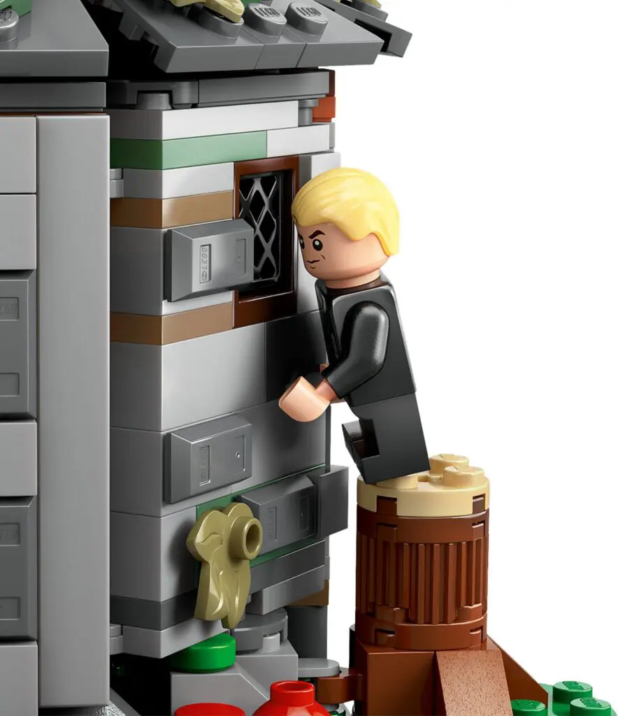 Toy figure climbing on building