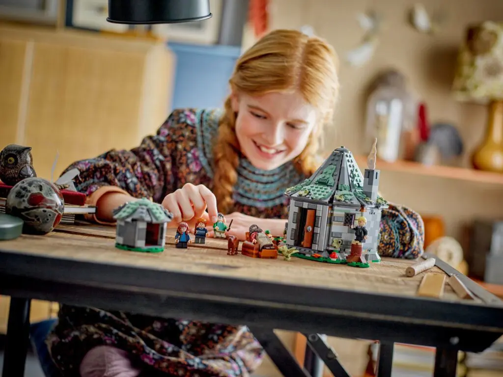 Child playing with building blocks set