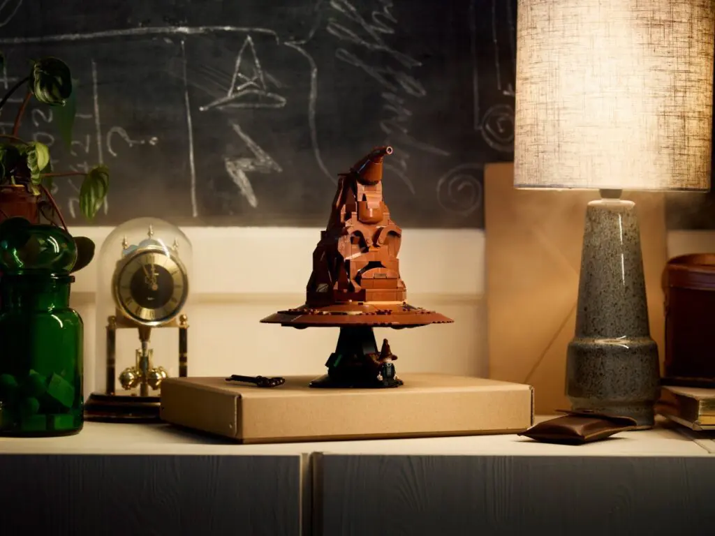 Wooden sculpture on desk with lamp