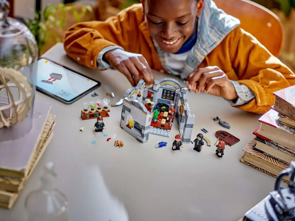 Child building with LEGO bricks