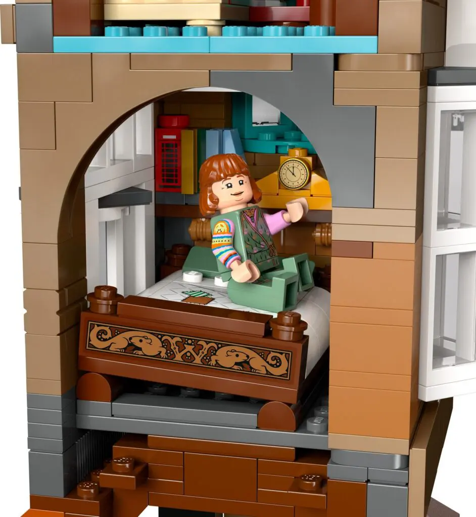 Mini figure sitting on a bed