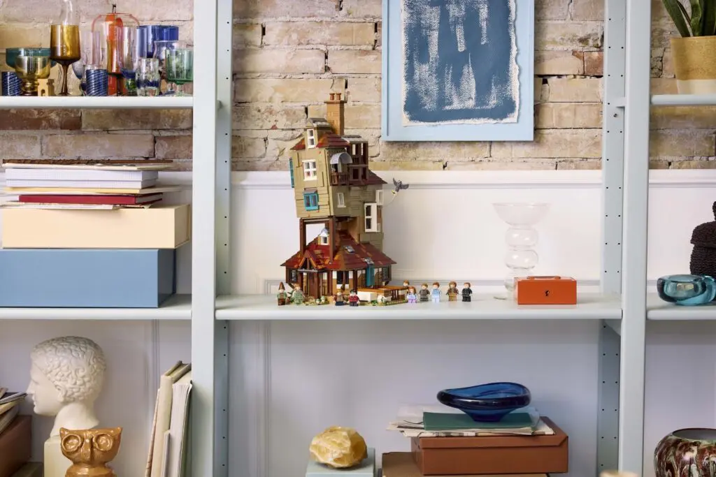 Brick wall behind artistic shelf arrangement
