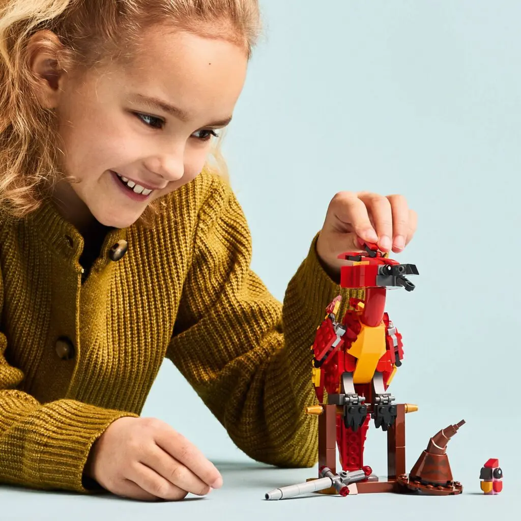 Kid assembling dinosaur model kit