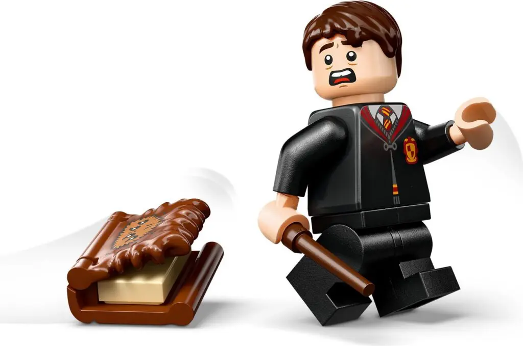 Mini figure with scared expression and book