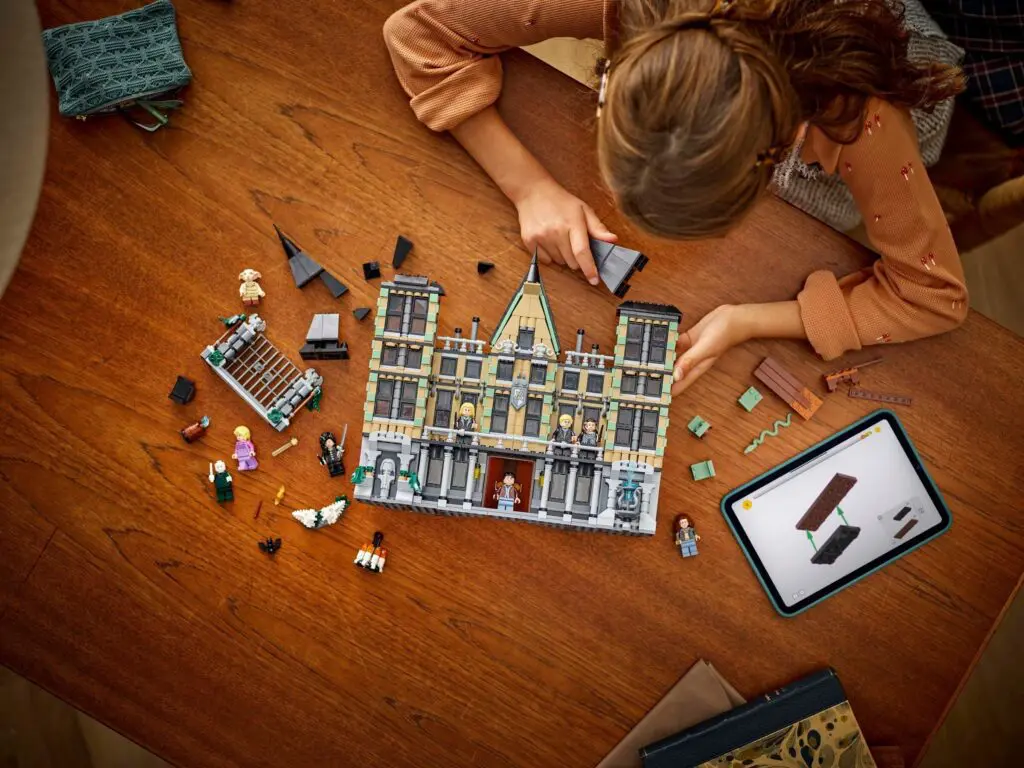 Girl focused on LEGO construction project