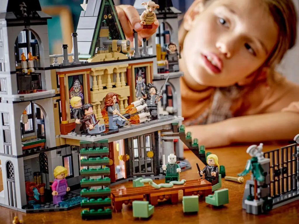 Child playing with detailed building set