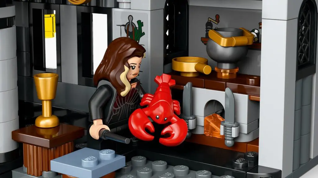 Lego figure holding a red lobster