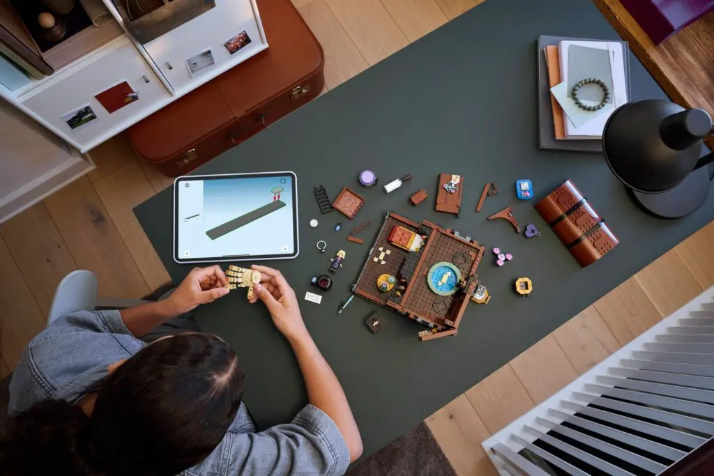 Creative workspace with LEGO pieces and tablet