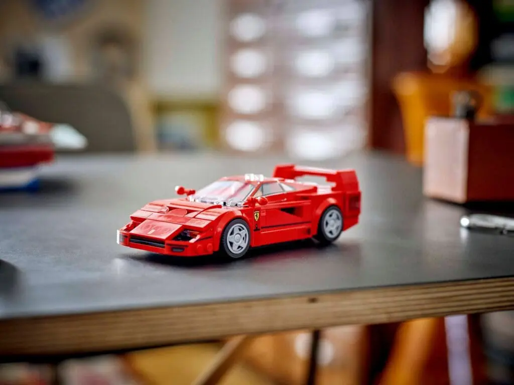 Miniature red car model indoors