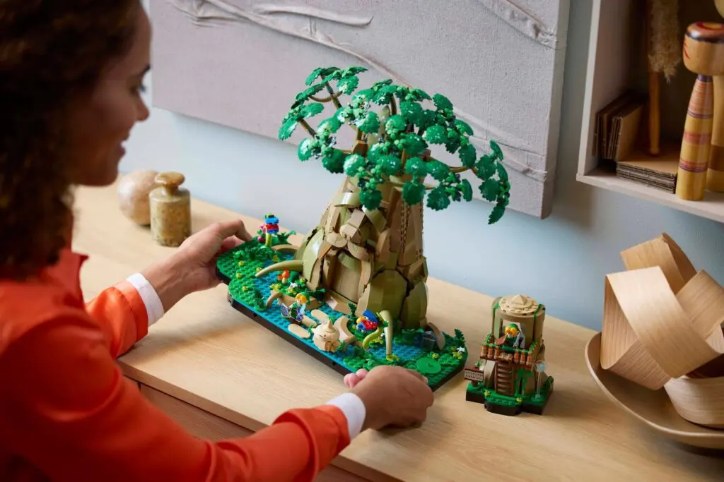 Woman assembling detailed tree model