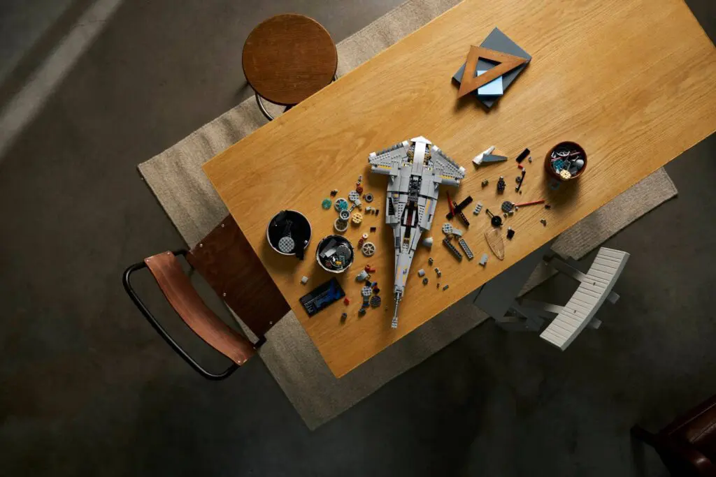 Overhead view of LEGO pieces and spaceship