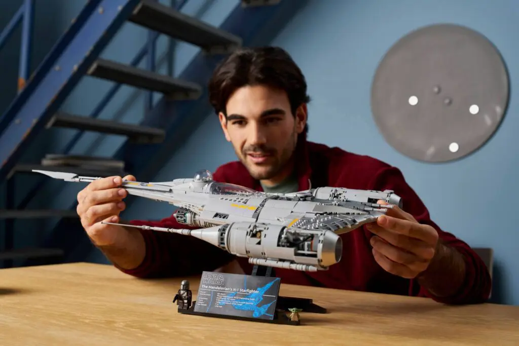 Enthusiast assembling spaceship replica