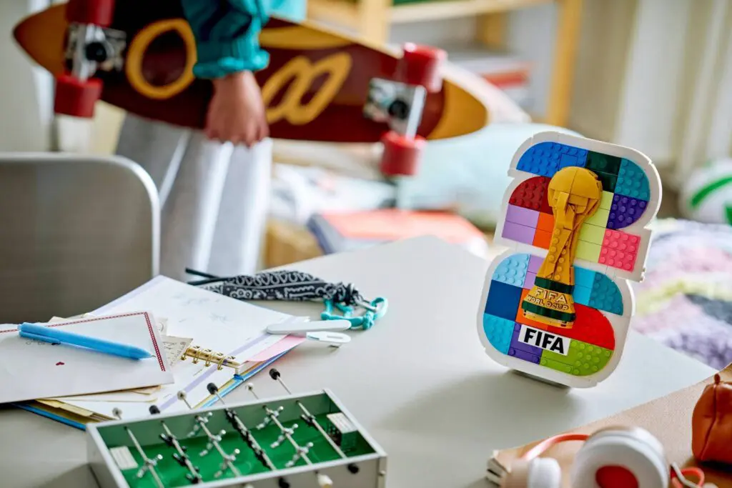 Foosball game and skateboard in room