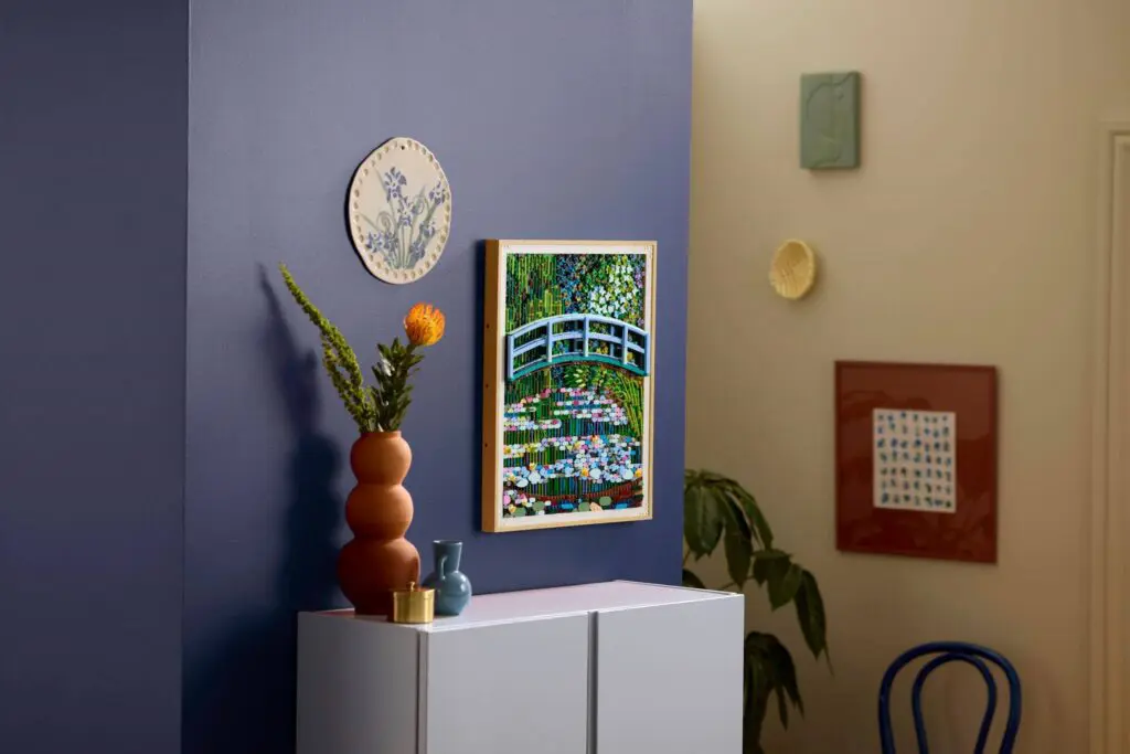 Vase with flowers on cabinet in room