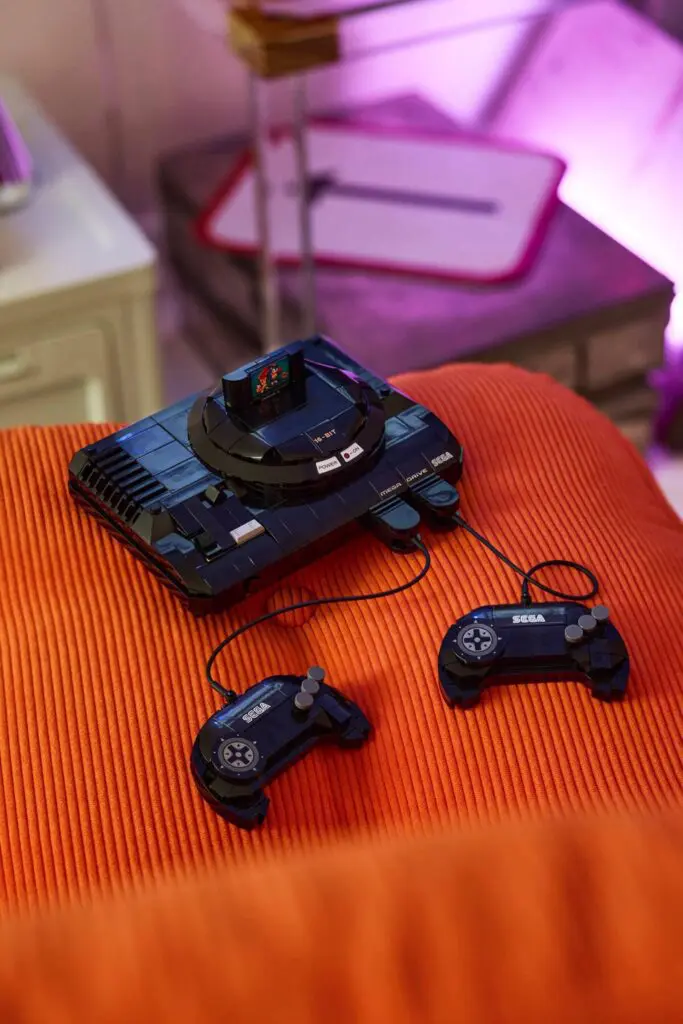 Vintage game system on orange surface