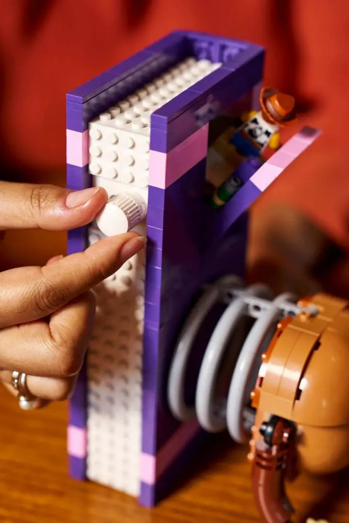 Person adjusting LEGO creation details
