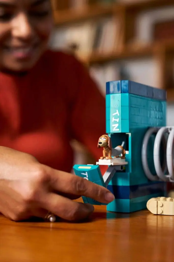 Person playing with colorful LEGO set