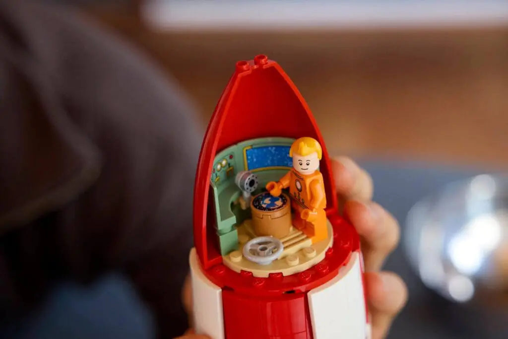 Mini astronaut in toy spacecraft