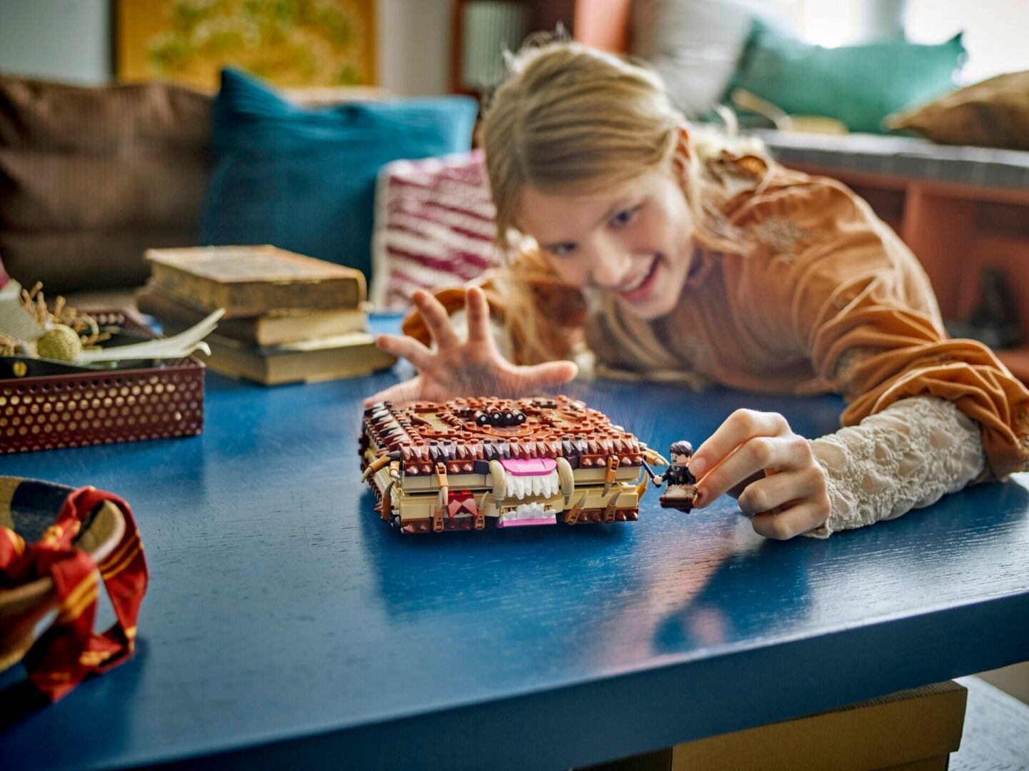 Smiling kid reaching for a model book